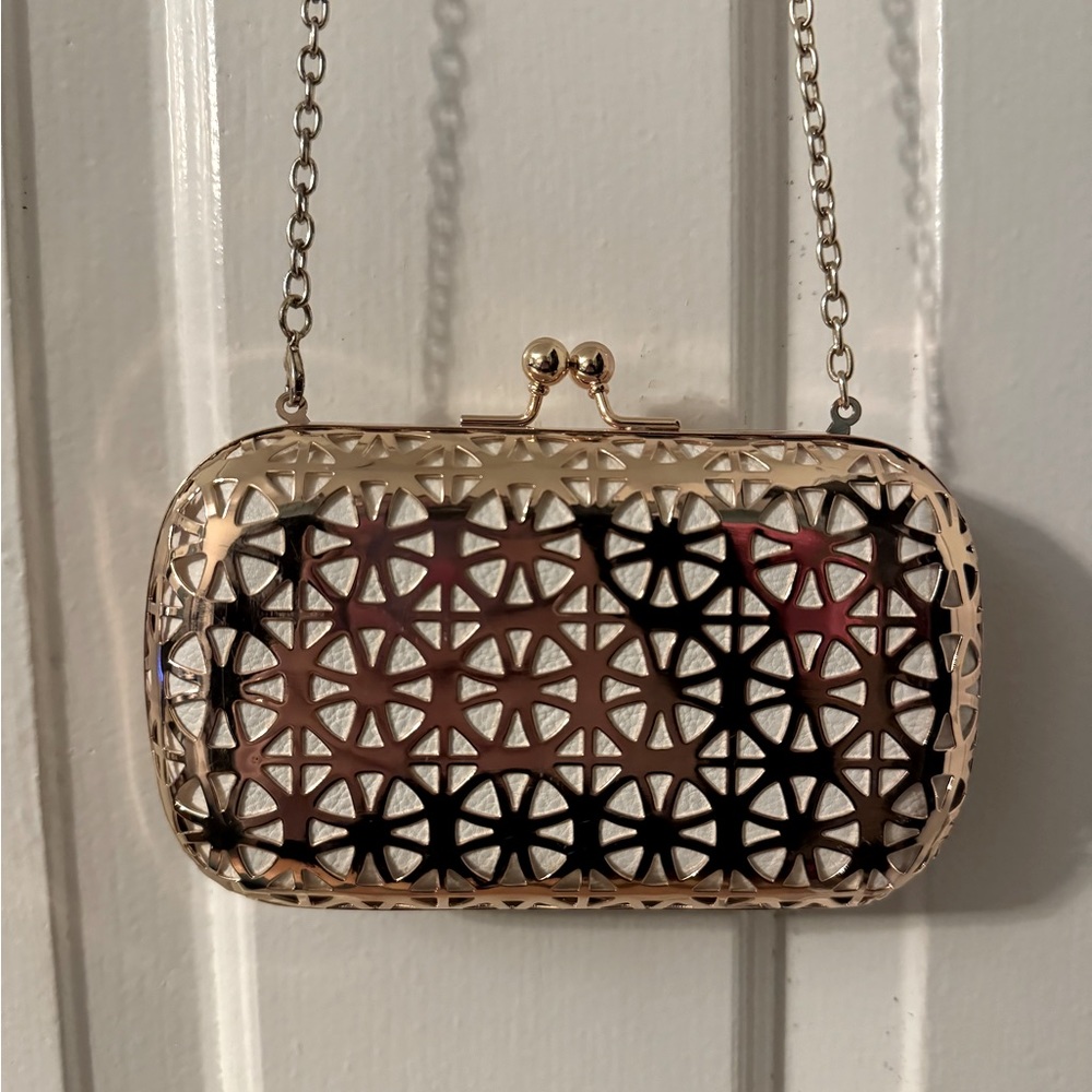 Big Buddha rose gold toned metal clutch
